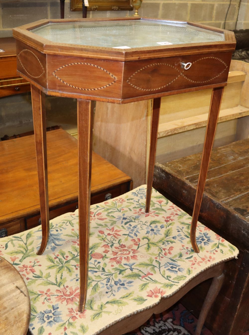 An Edwardian Sheraton style inlaid mahogany bijouterie table, c.1830, W.56cm, D.40cm, H.72cm